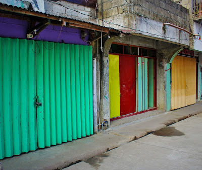 Garage doors brightly coloured in Sagada.