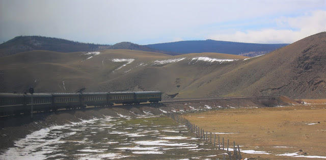 Trans-Mongolian train rolling through Mongolia. trains
