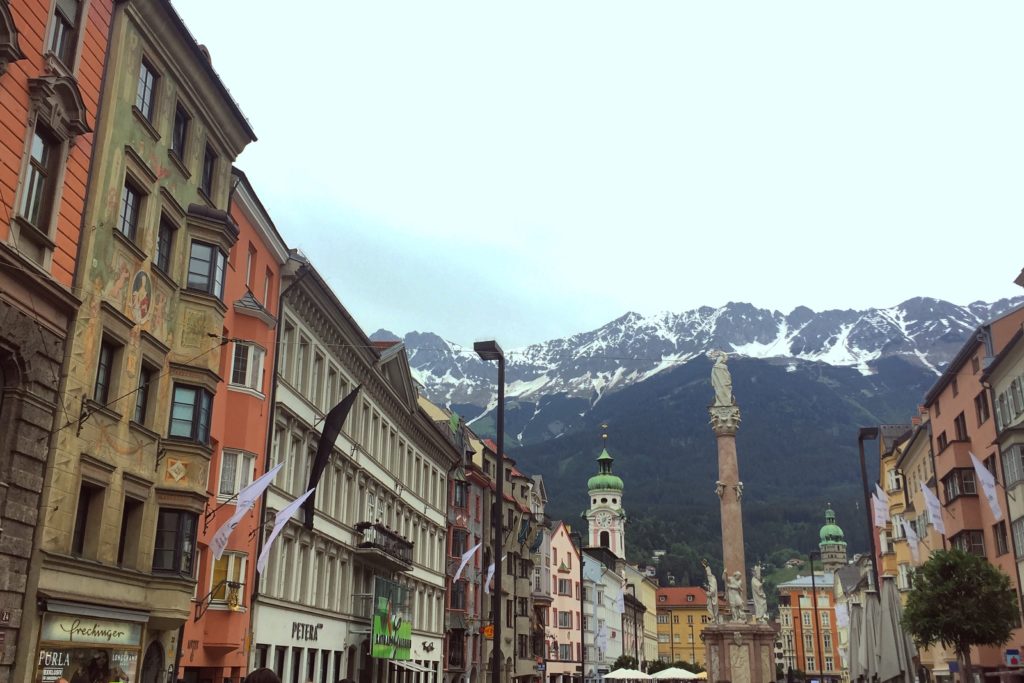 Innsbruck - old buildings in the Old Town with the mountains in the background