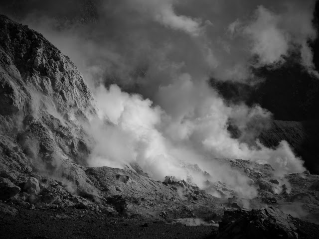 Clouds of steam erupting from the volcano on White Island - in black and white.
