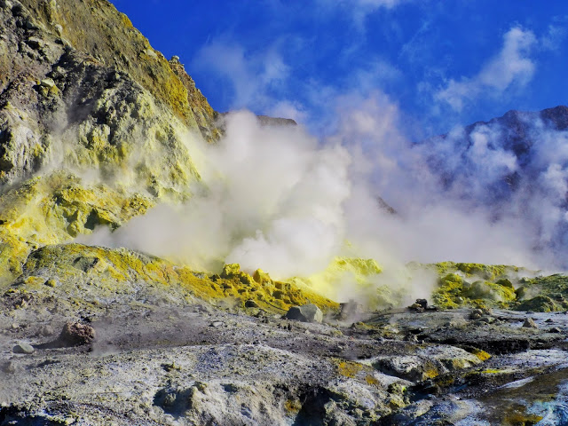 Clouds of steam and yellow rocks on White Island.