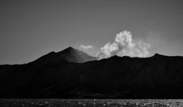 White Island - a view of the volcano from a distance, in black and white.