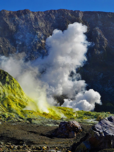 Clouds of steam and yellow rocks on White Island.