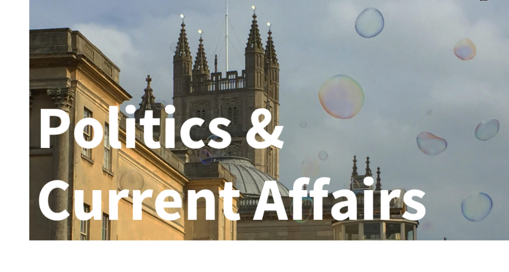 Archives: Politics & Current Affairs - text overlaying an image of a cathedral steeple reaching up into grey skies, with bubbles in the foreground.
