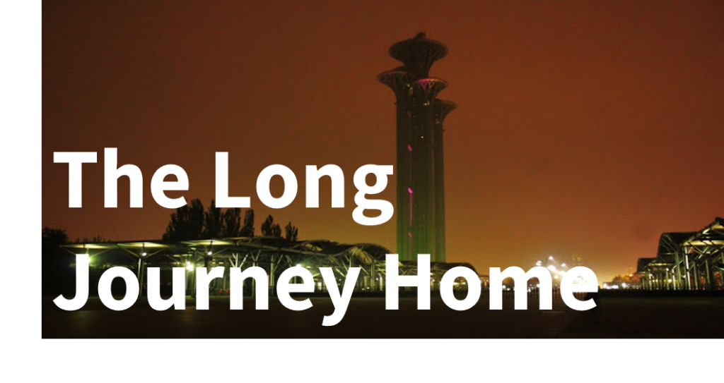 Blog Travel: Long Journey Home - text overlaying an image of a tall UFO style tower, with a glowing orange sky at night time.