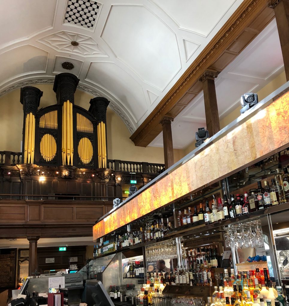 Dublin - the Church Cafe. The old organ is on the wall in the background, with the newer bar area in the foreground.