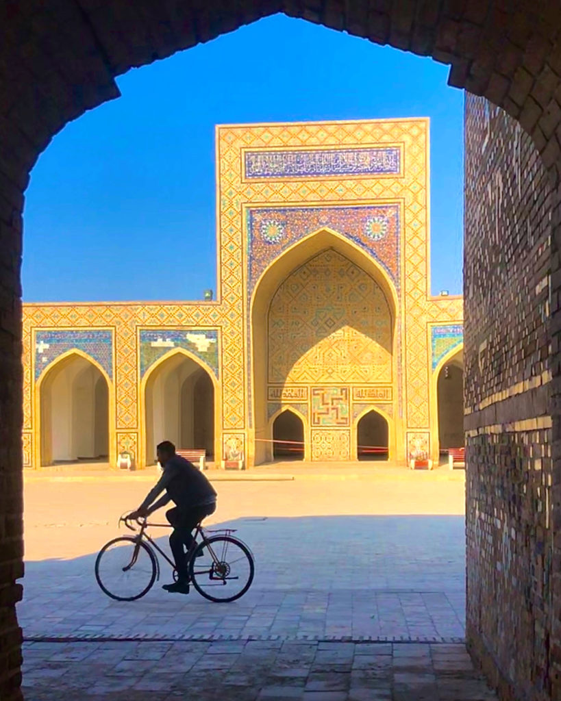 A cyclist in a mosque in Bukhara, Uzbekistan.