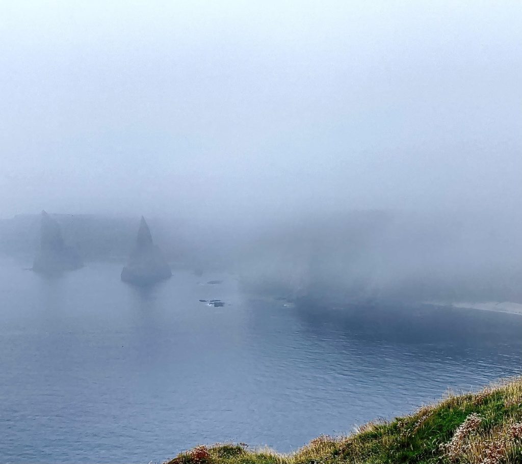 A misty coastline with jagged rocks part 2